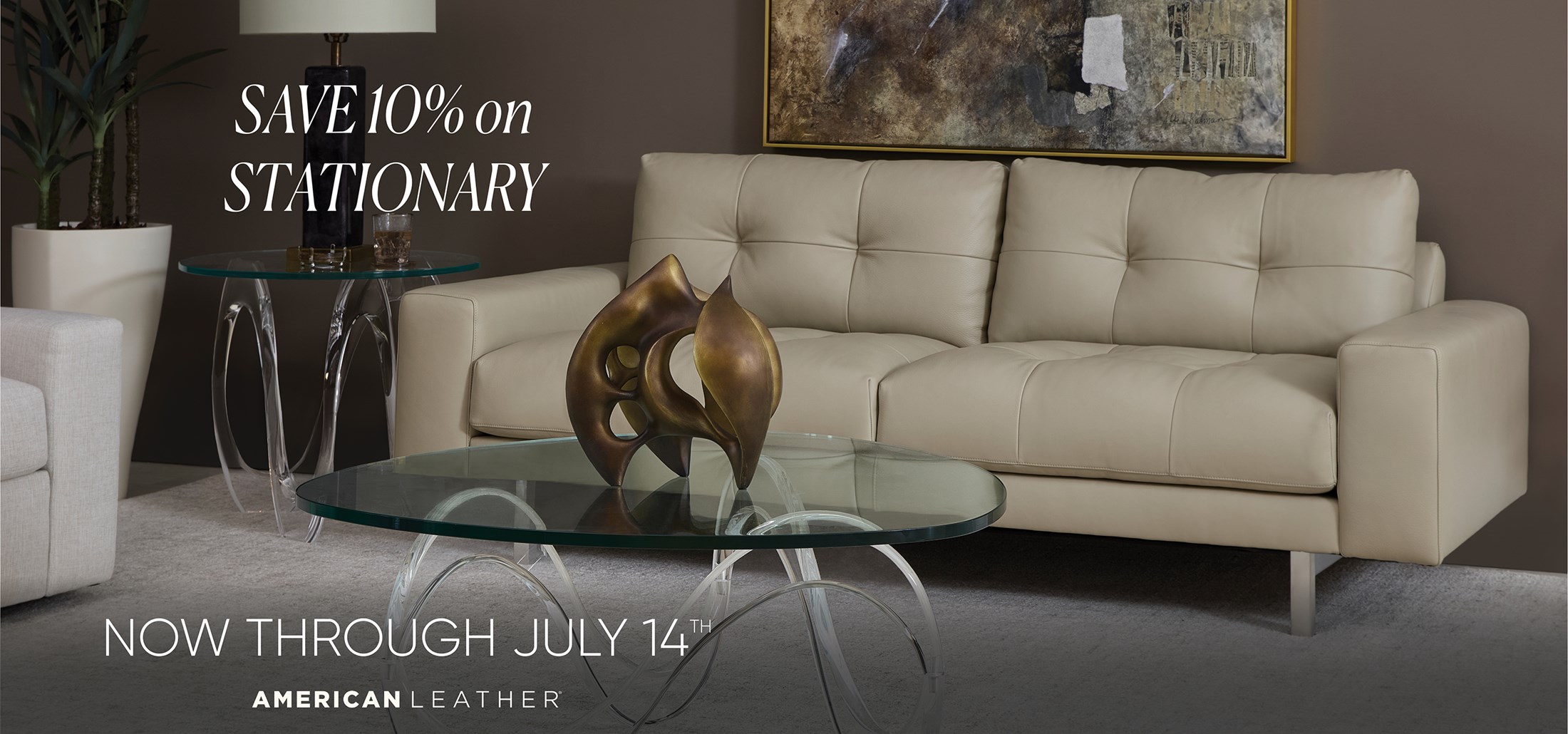 Image of the Montara Studio Sofa on a brown wall. Text: Save 10% off Stationary. Now through July 14th. American Leather.