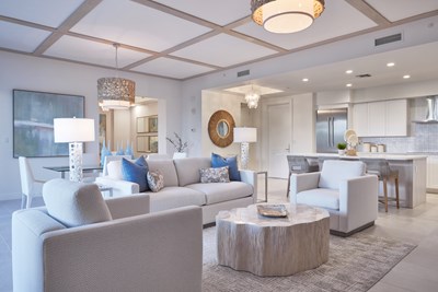 Image of the Coquina Living Room with neutral tones and blue accents.