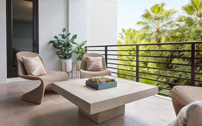 Image of Coquina Outdoor Space with natural textures and square cocktail table.