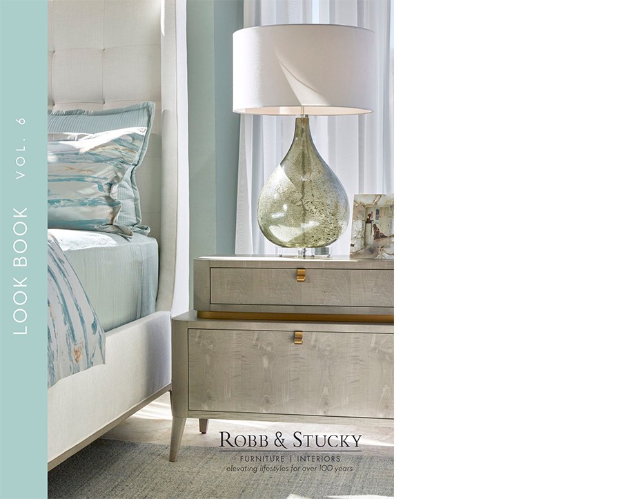 Cover of 2024 Lookbook featuring a white upholstered bed and nightstand with light blue decor.