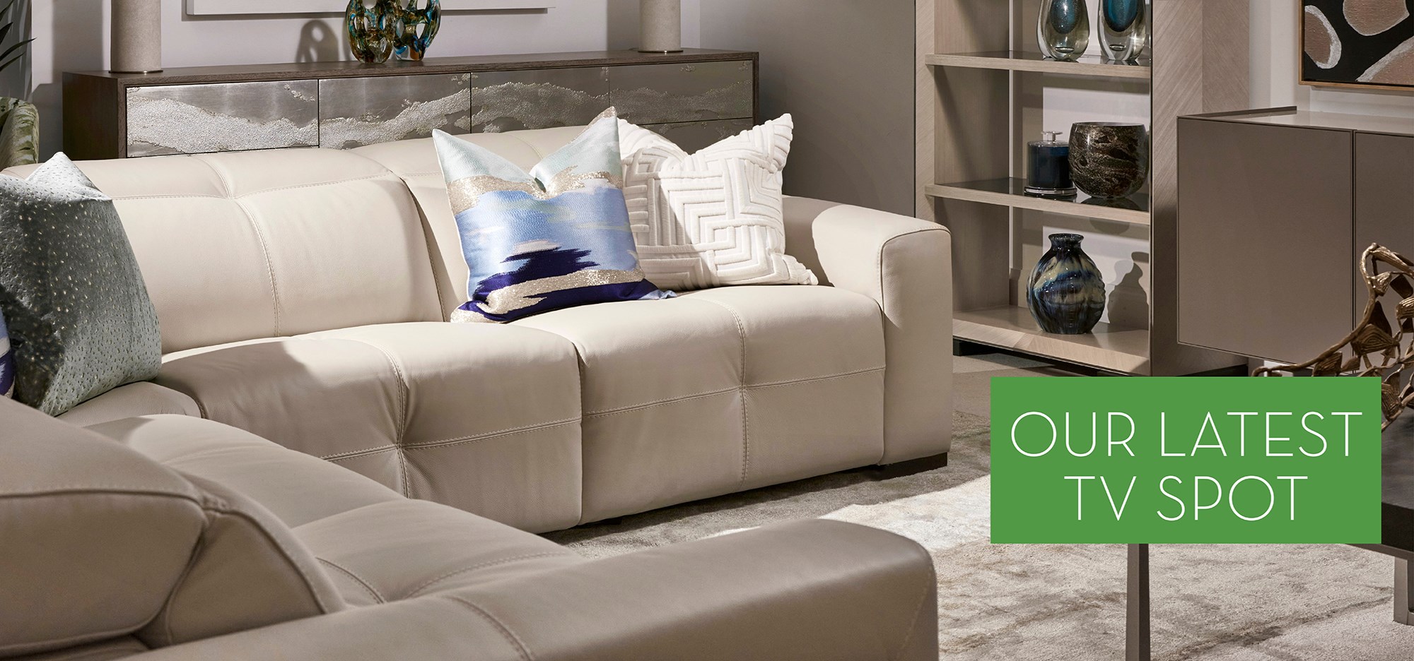 Image of the Axel Sectional. Text: Our Latest TV Spot. Links to TV Spot on Youtube.
