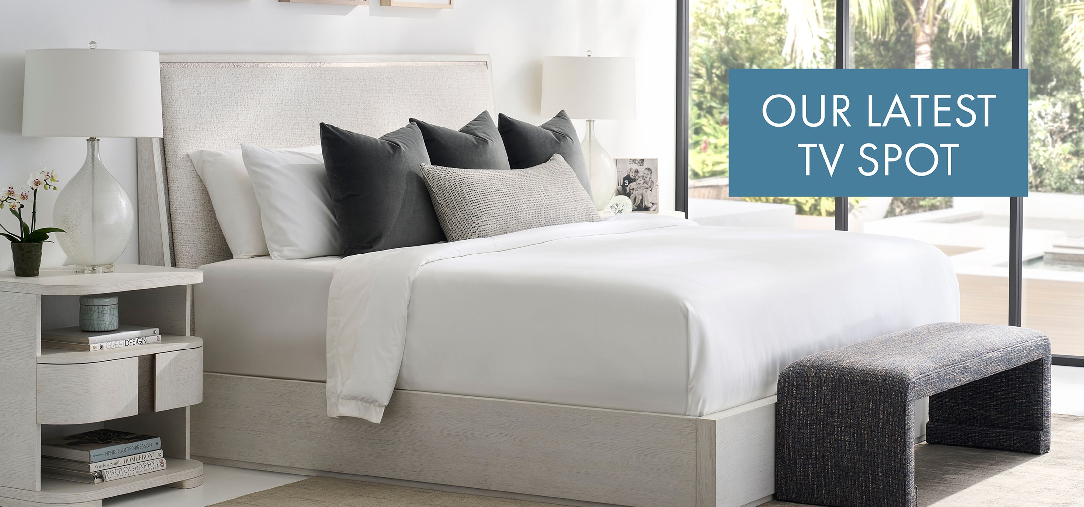 Image of the Carino King Bed & nightstand. Text: Our Latest TV Spot. Links to TV Spot on Youtube.