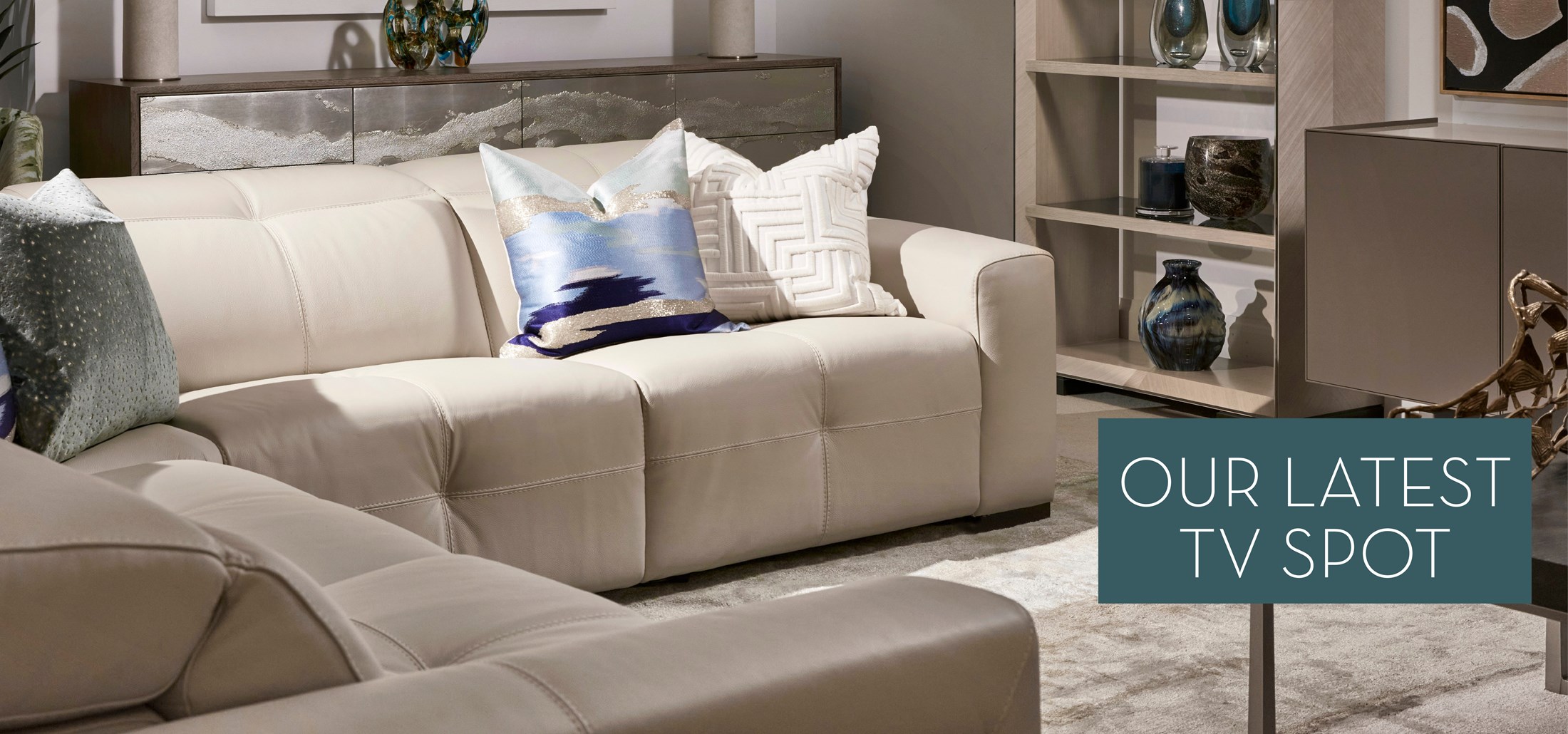Image of the Axel Sectional. Text: Our Latest TV Spot. Links to Designer Favorites TV spot on Youtube.