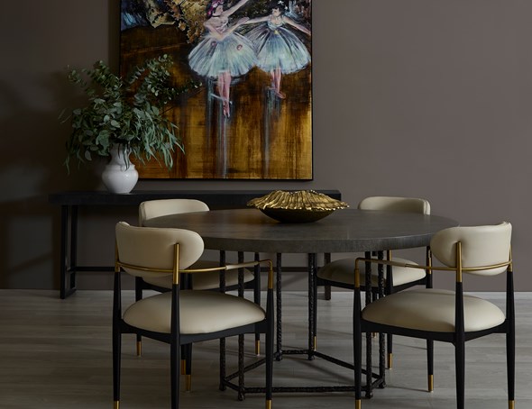 Moody dining space with ballerina wall art.