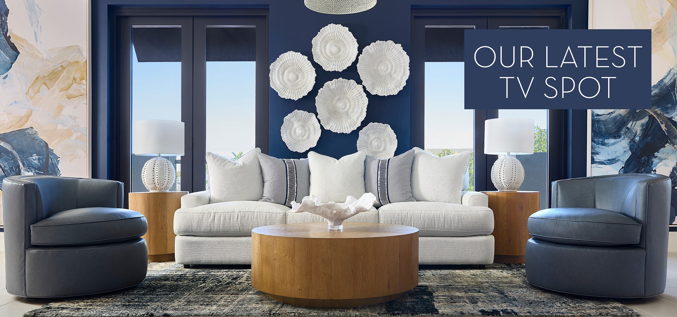 Image of the Room Service by R&S Palm Island Living Space. Text: Our Latest TV Spot. Links to the Sizzling Summer TV Spot on Youtube. 