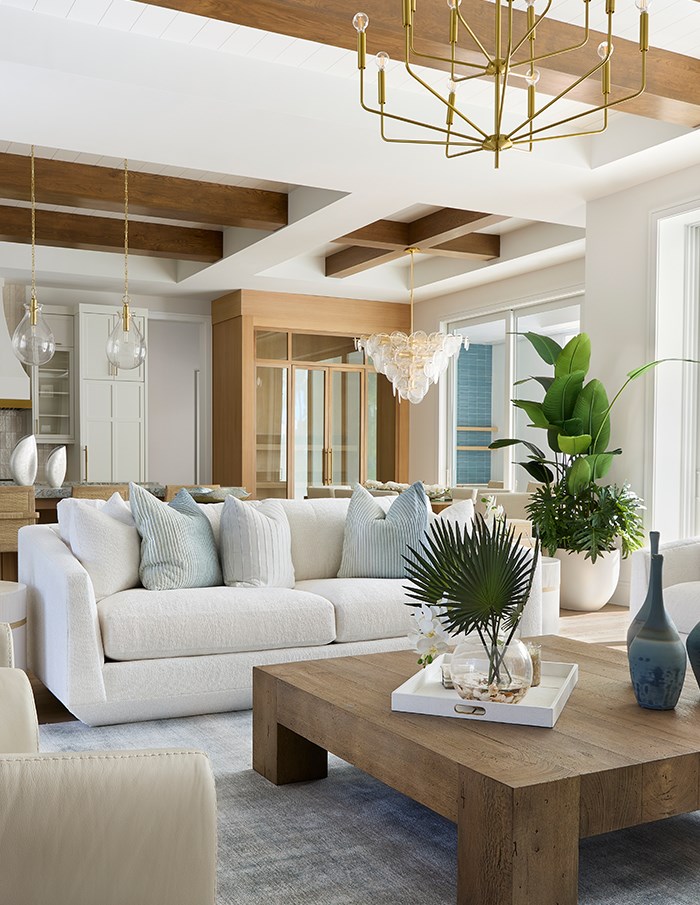 Image of a neutral living space with light blue accents. Links to Blog.