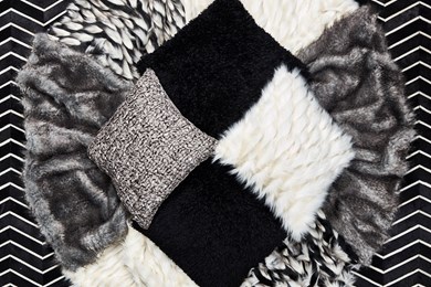 a top view photo of black and white contemporary pillows